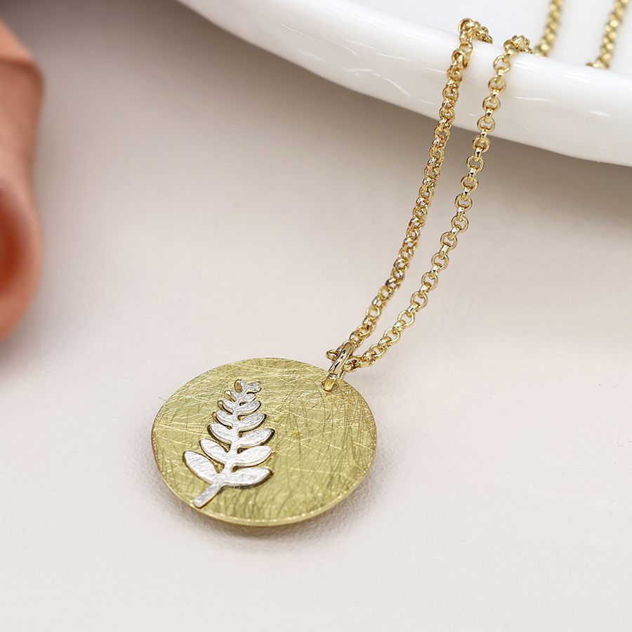 POM 04224 Faux gold scratched disc necklace with silver plated fern inlay