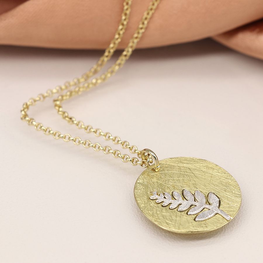 POM 04224 Faux gold scratched disc necklace with silver plated fern inlay