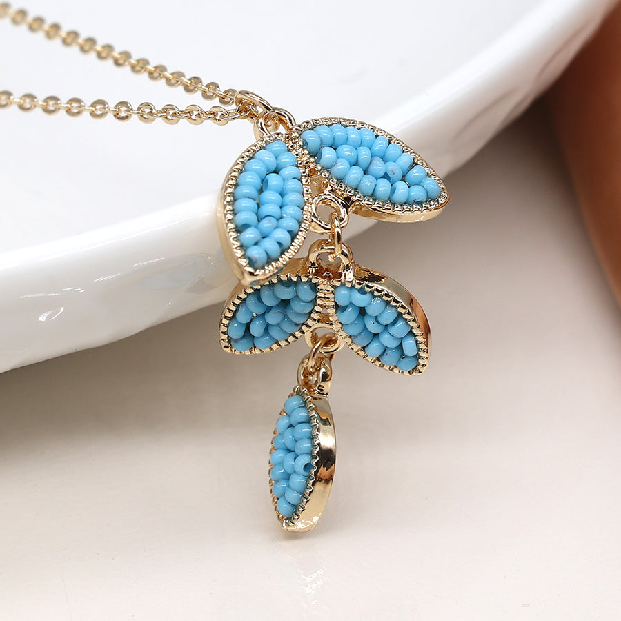 POM Golden and blue bead leaf drop necklace  04346